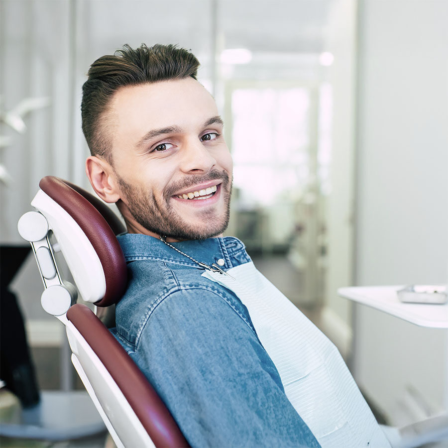 Smiling patient in dental chair at JW Dental Phoenixville